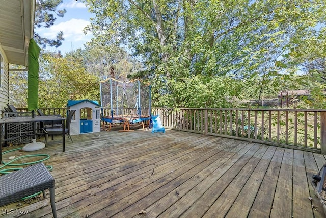 7319 Guilford Rd, Seville, OH 44273 - wooden deck with a trampoline