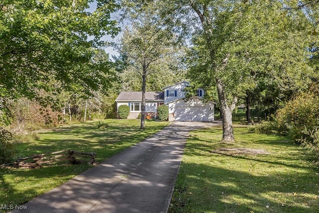 7319 Guilford Rd, Seville, OH 44273 - split level home featuring a front lawn and driveway