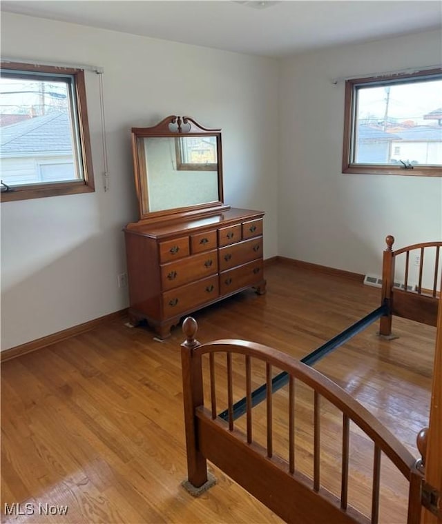 4830 Autumn Ln, Brooklyn, OH 44144 - bedroom with visible vents, light wood-style flooring, and baseboards