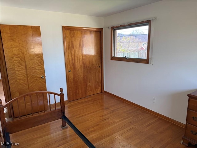 4830 Autumn Ln, Brooklyn, OH 44144 - unfurnished bedroom with light wood finished floors and baseboards