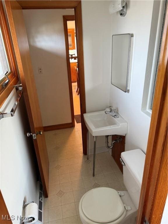 4830 Autumn Ln, Brooklyn, OH 44144 - half bath featuring tile patterned floors, a sink, and toilet