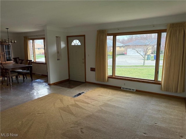 4830 Autumn Ln, Brooklyn, OH 44144 - foyer featuring an inviting chandelier, baseboards, and visible vents