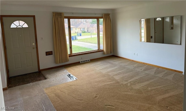 4830 Autumn Ln, Brooklyn, OH 44144 - foyer entrance with carpet, visible vents, and baseboards