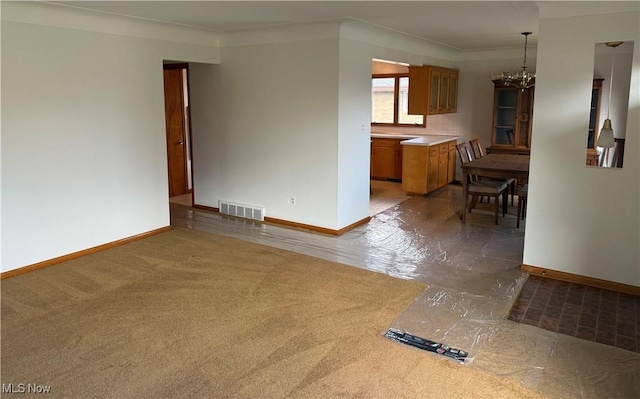 4830 Autumn Ln, Brooklyn, OH 44144 - unfurnished living room featuring carpet flooring, visible vents, baseboards, and an inviting chandelier