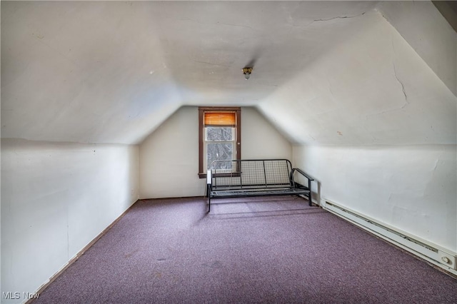 additional living space featuring baseboard heating, carpet floors, and lofted ceiling