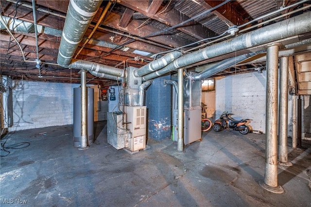 unfinished basement featuring gas water heater and heating unit