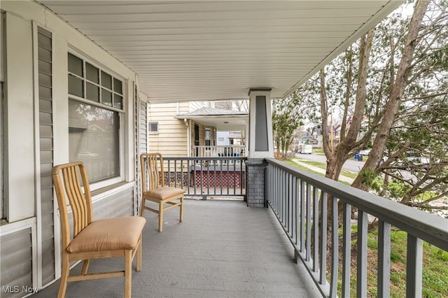 balcony featuring a porch