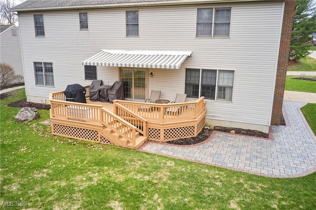 4339 Sierra Dr, Copley, OH 44321 - rear view of house with a patio area, a yard, and a deck