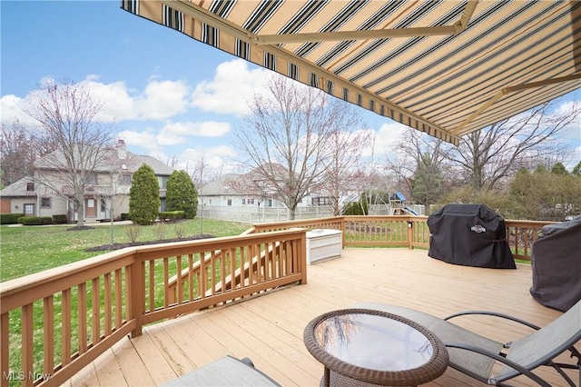 4339 Sierra Dr, Copley, OH 44321 - wooden terrace with area for grilling, a residential view, a lawn, and a playground