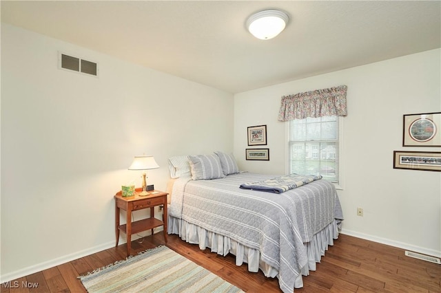 4339 Sierra Dr, Copley, OH 44321 - bedroom featuring baseboards, wood finished floors, and visible vents