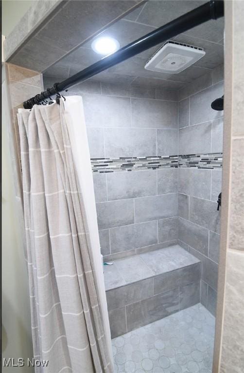 bathroom featuring a shower stall