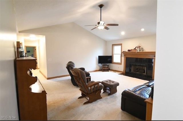 living room featuring baseboards, a fireplace, a ceiling fan, lofted ceiling, and carpet