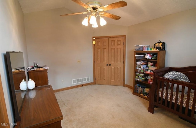 bedroom with visible vents, baseboards, ceiling fan, and carpet