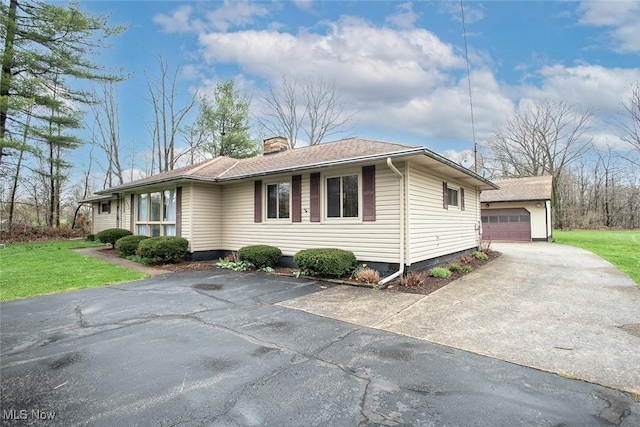3035 Hamilton Rd, Medina, OH 44256 - view of front of house featuring an outbuilding, a garage, a front lawn, and a chimney