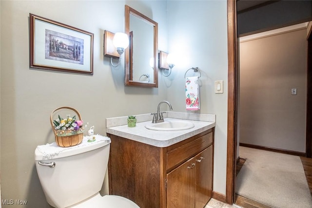 3035 Hamilton Rd, Medina, OH 44256 - bathroom with toilet, vanity, and baseboards