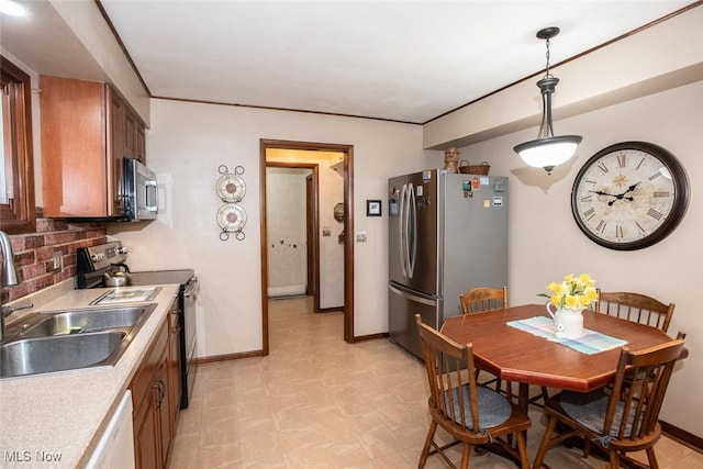 3035 Hamilton Rd, Medina, OH 44256 - kitchen with baseboards, a sink, light floors, and appliances with stainless steel finishes