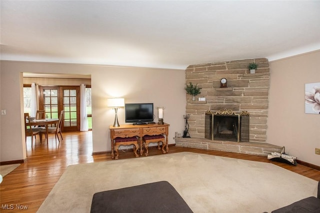 3035 Hamilton Rd, Medina, OH 44256 - living room featuring a fireplace, baseboards, and wood finished floors
