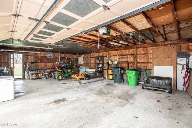 3035 Hamilton Rd, Medina, OH 44256 - garage featuring wood walls and a garage door opener
