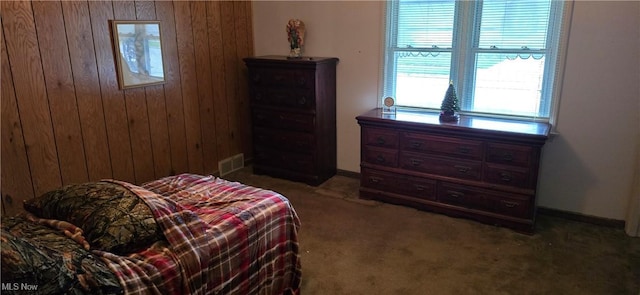 1352 Madison Ave, Lorain, OH 44053 - bedroom with carpet flooring, baseboards, wooden walls, and visible vents