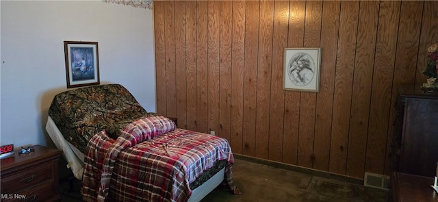 1352 Madison Ave, Lorain, OH 44053 - sitting room featuring concrete flooring, wood walls, and visible vents