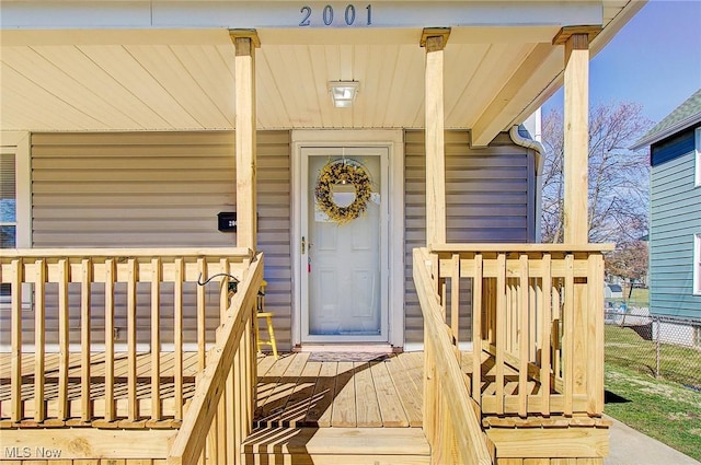 view of exterior entry with fence