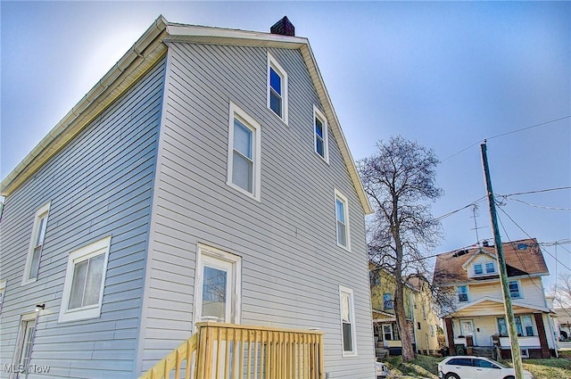 view of side of property with a chimney