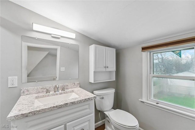 43 Hamilton Ave, Poland, OH 44514 - bathroom with toilet, vanity, baseboards, and lofted ceiling