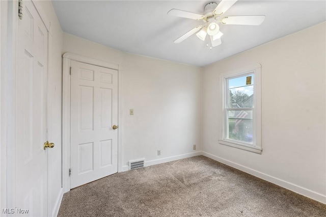 43 Hamilton Ave, Poland, OH 44514 - carpeted spare room featuring visible vents, baseboards, and a ceiling fan