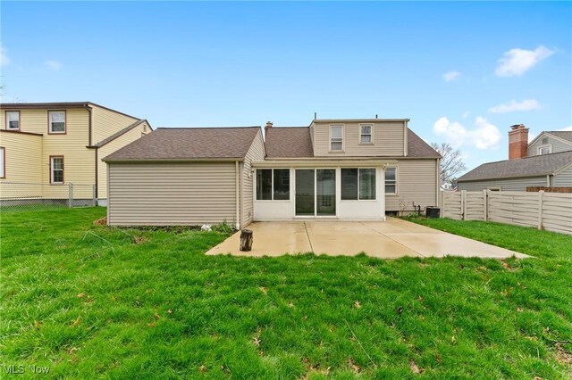 43 Hamilton Ave, Poland, OH 44514 - rear view of house featuring central AC, a shingled roof, a patio area, a yard, and a fenced backyard