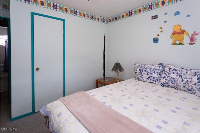 carpeted bedroom featuring a closet