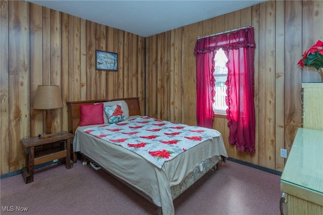 bedroom featuring wooden walls