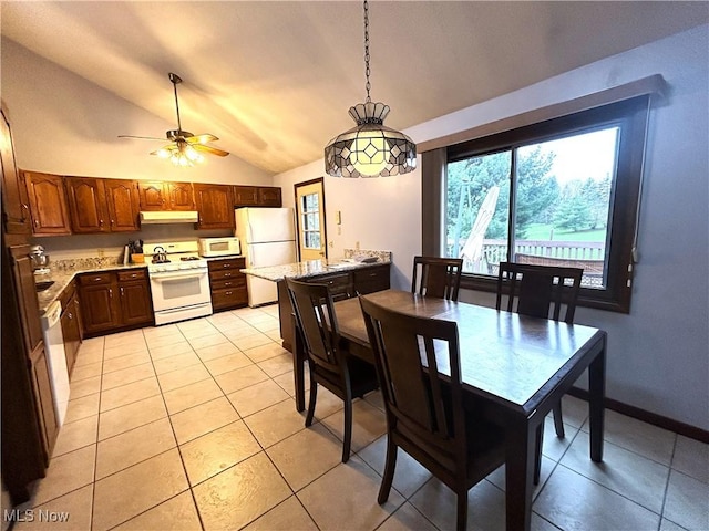 7366 Cromwell Dr, Solon, OH 44139 - dining space featuring light tile patterned floors, ceiling fan, and lofted ceiling