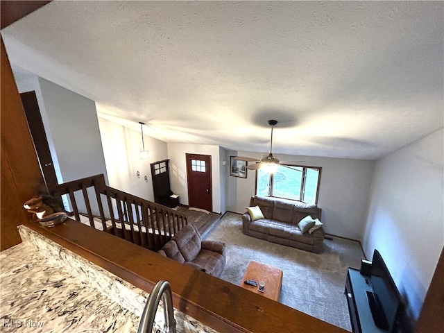 7366 Cromwell Dr, Solon, OH 44139 - living area with carpet flooring, a textured ceiling, and ceiling fan