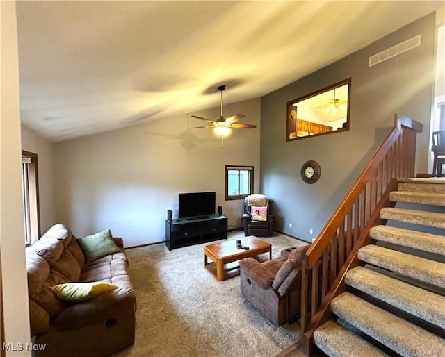 7366 Cromwell Dr, Solon, OH 44139 - carpeted living room with baseboards, a ceiling fan, stairs, visible vents, and lofted ceiling