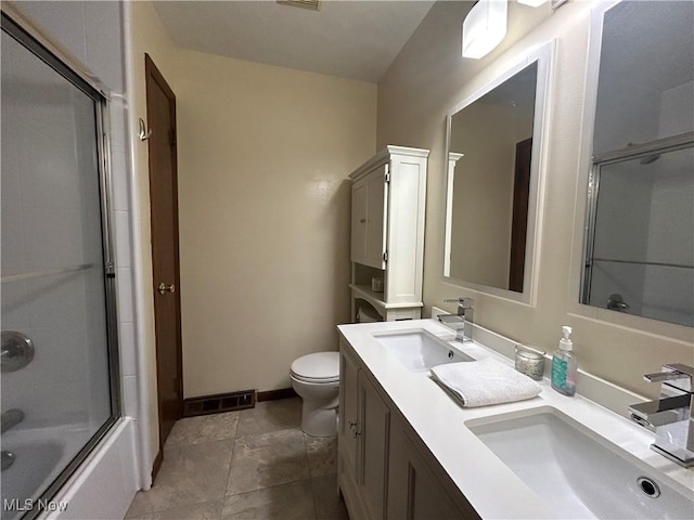 7366 Cromwell Dr, Solon, OH 44139 - bathroom featuring toilet, a sink, combined bath / shower with glass door, and visible vents
