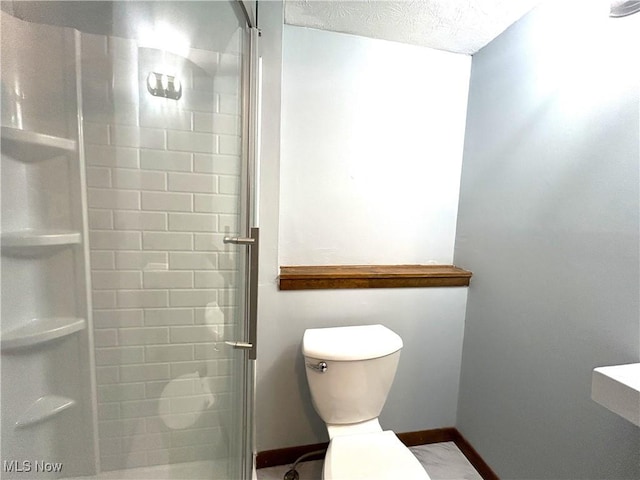 7366 Cromwell Dr, Solon, OH 44139 - bathroom with a shower stall, a textured ceiling, baseboards, and toilet