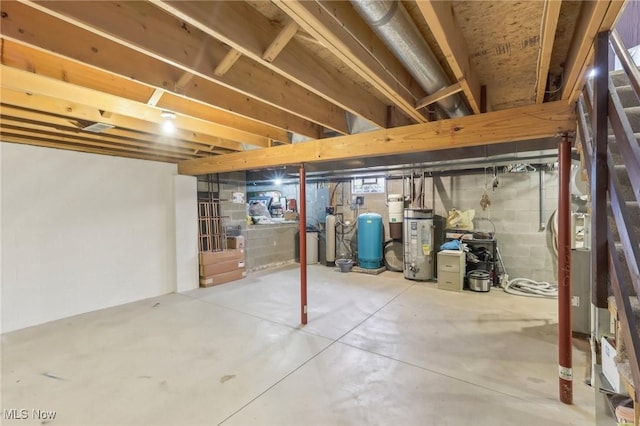 unfinished below grade area featuring gas water heater