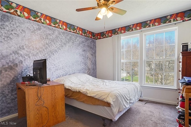 bedroom with carpet, baseboards, wallpapered walls, and ceiling fan
