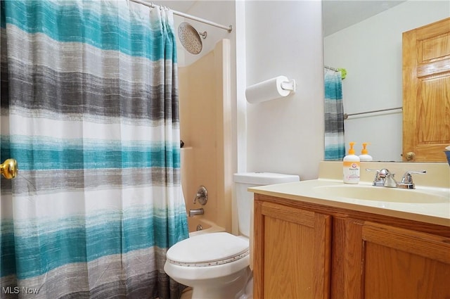 bathroom featuring shower / tub combo, vanity, and toilet