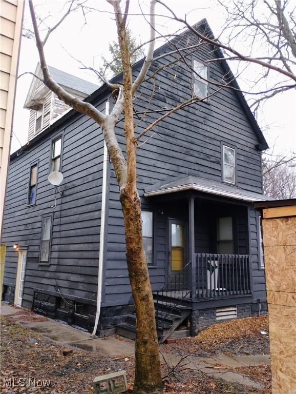 6010 Maurice Ave, Cleveland, OH 44127 - view of side of property with a porch