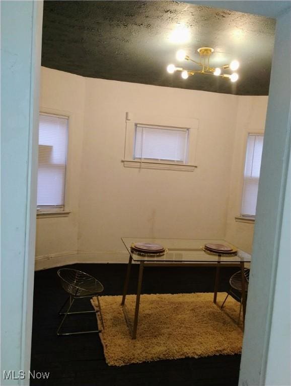 6010 Maurice Ave, Cleveland, OH 44127 - home office featuring baseboards and an inviting chandelier