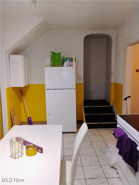6010 Maurice Ave, Cleveland, OH 44127 - kitchen featuring marble finish floor and freestanding refrigerator