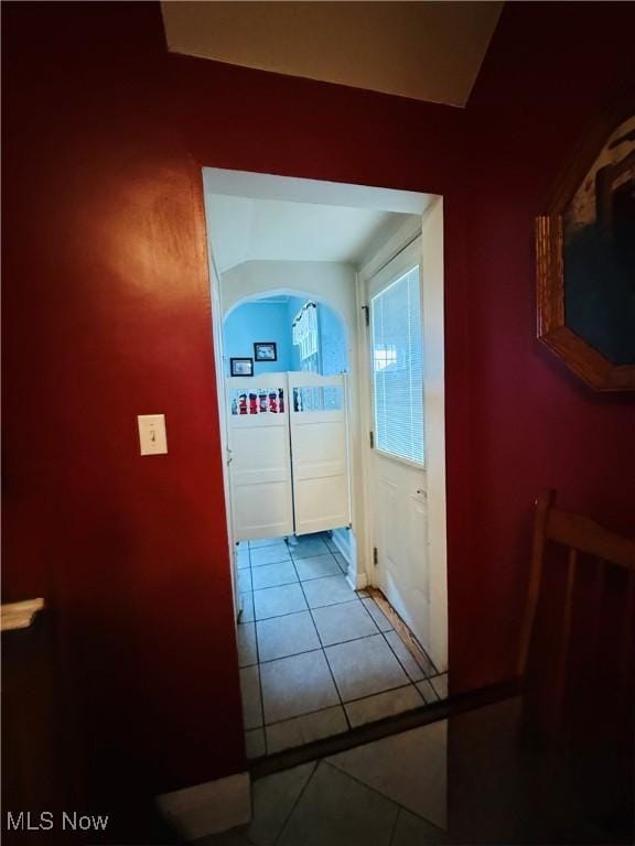 hall featuring tile patterned flooring