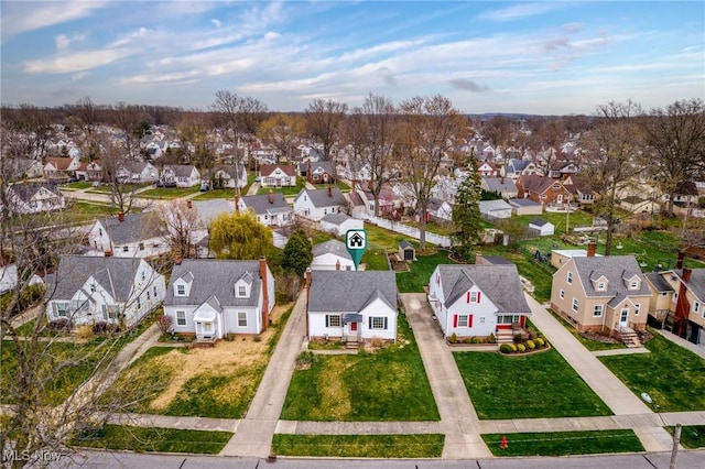 birds eye view of property with a residential view