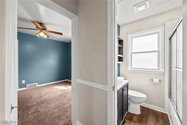 full bathroom with vanity, visible vents, a ceiling fan, and toilet