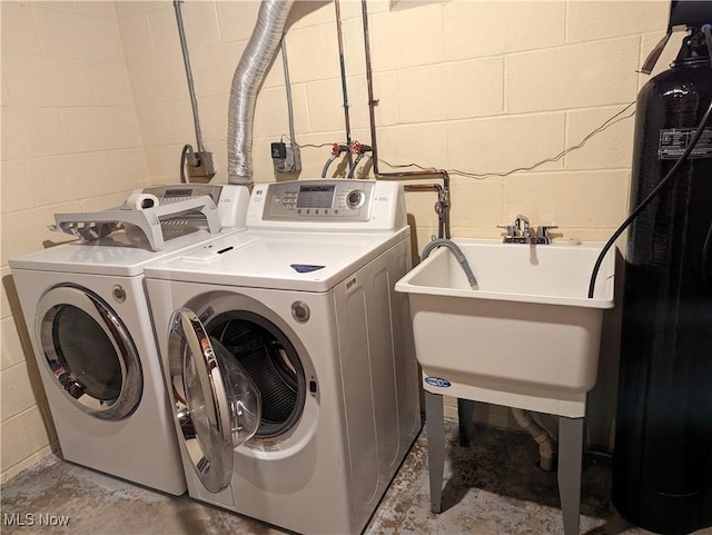 14864 Hayes Rd, Middlefield, OH 44062 - laundry room featuring separate washer and dryer and concrete block wall