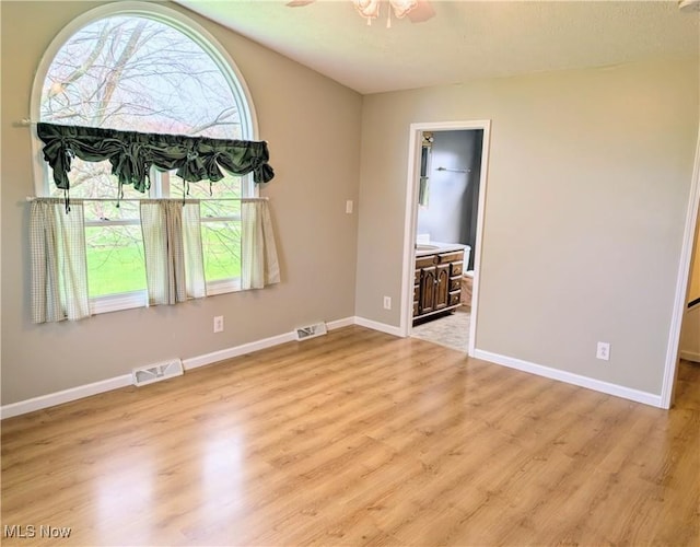 14864 Hayes Rd, Middlefield, OH 44062 - empty room with wood finished floors, ceiling fan, and baseboards