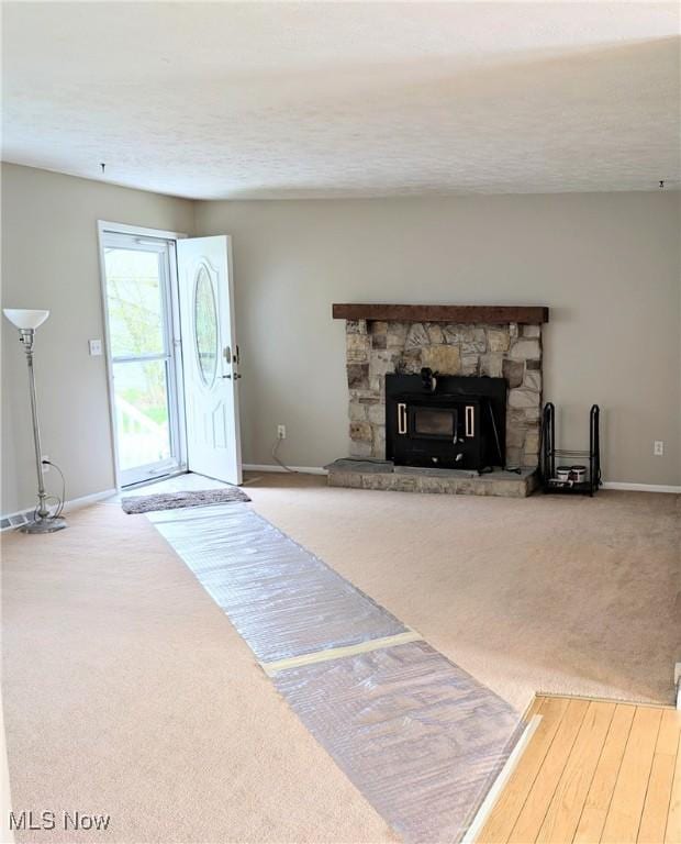 14864 Hayes Rd, Middlefield, OH 44062 - unfurnished living room featuring carpet flooring and baseboards