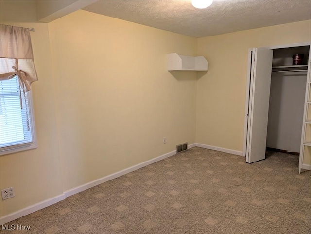 14864 Hayes Rd, Middlefield, OH 44062 - unfurnished bedroom with carpet, a textured ceiling, a closet, and baseboards