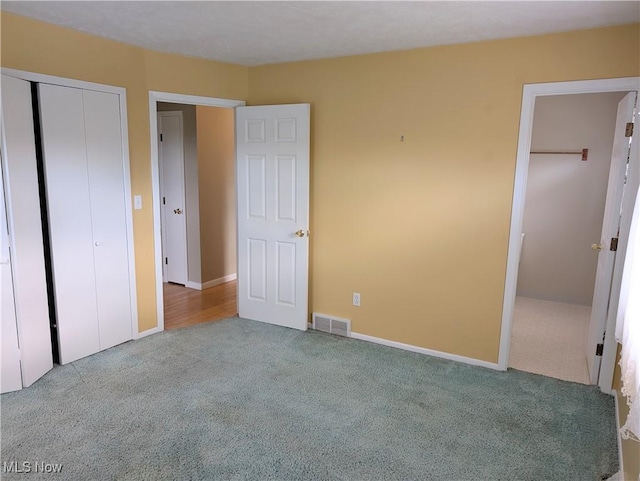 14864 Hayes Rd, Middlefield, OH 44062 - unfurnished bedroom with carpet floors, a closet, and baseboards